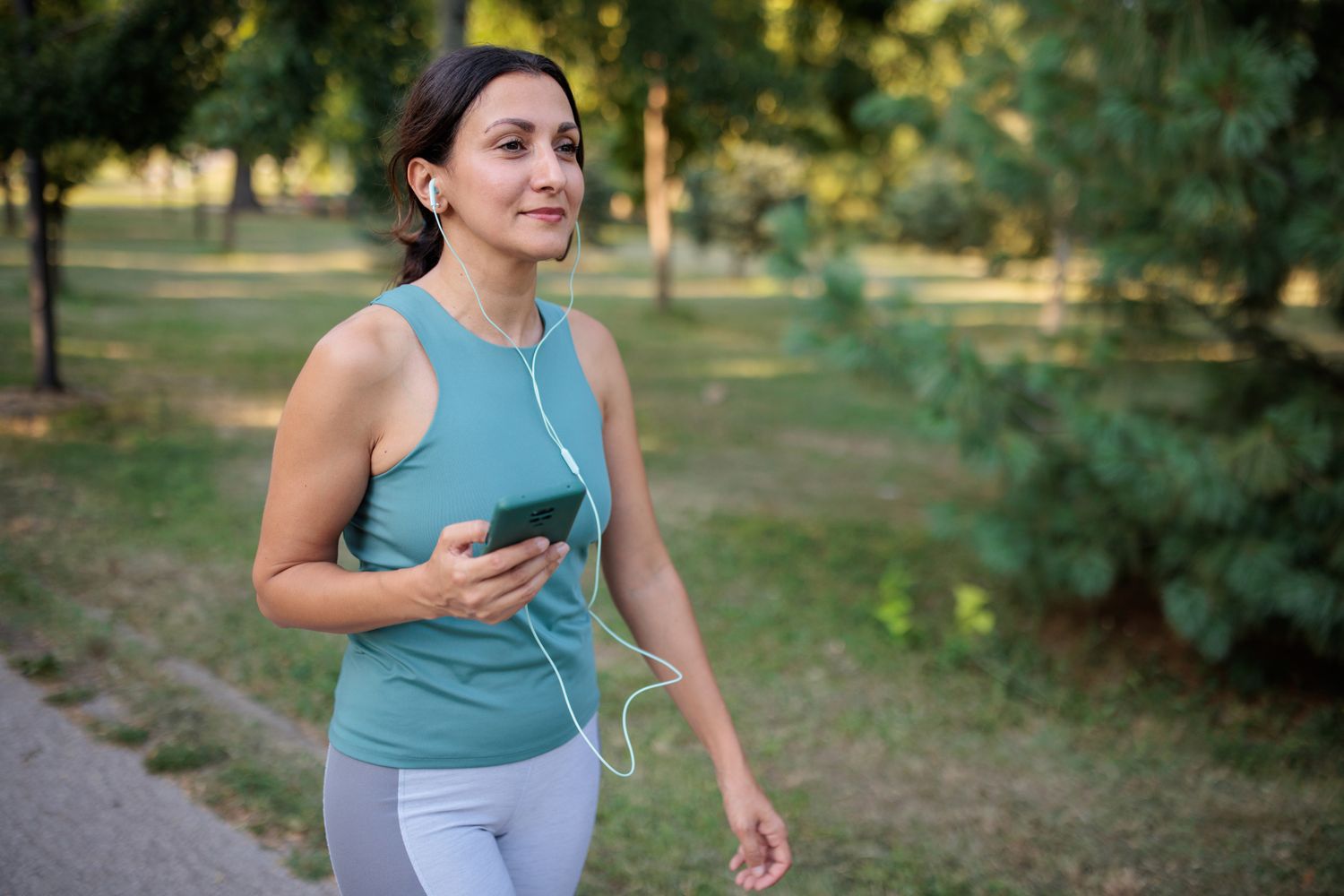 Person walking outdoors for fitness