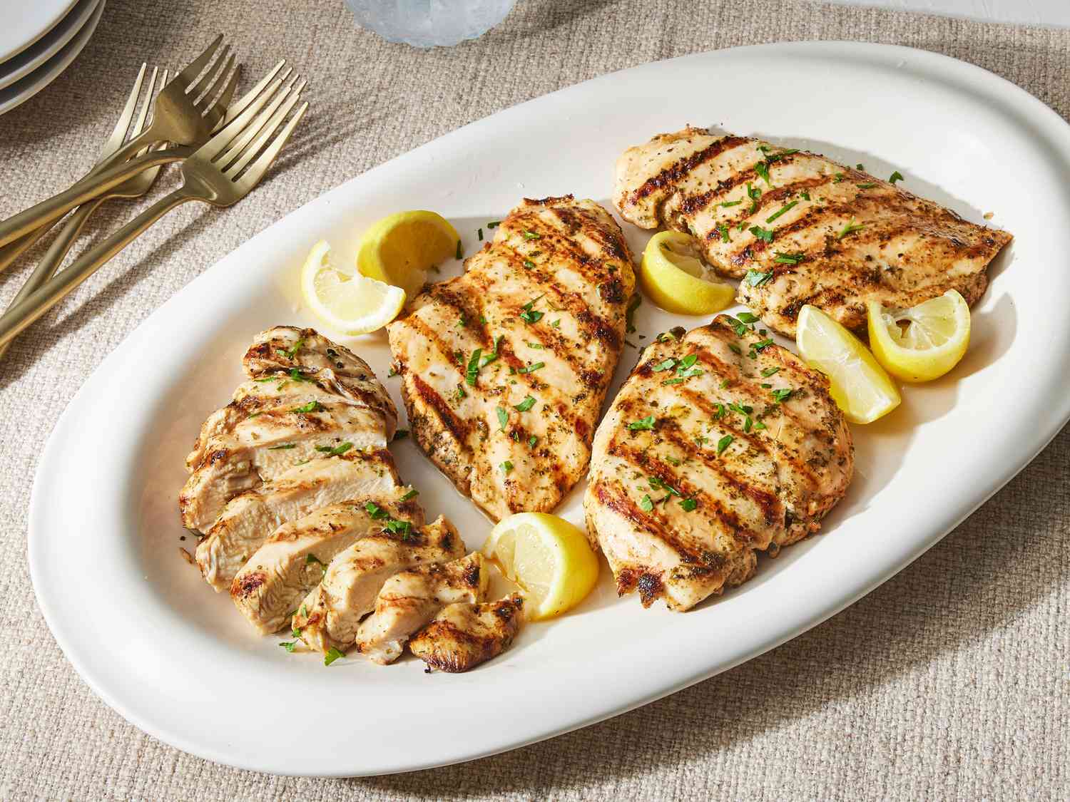 Grilled chicken breasts on plate