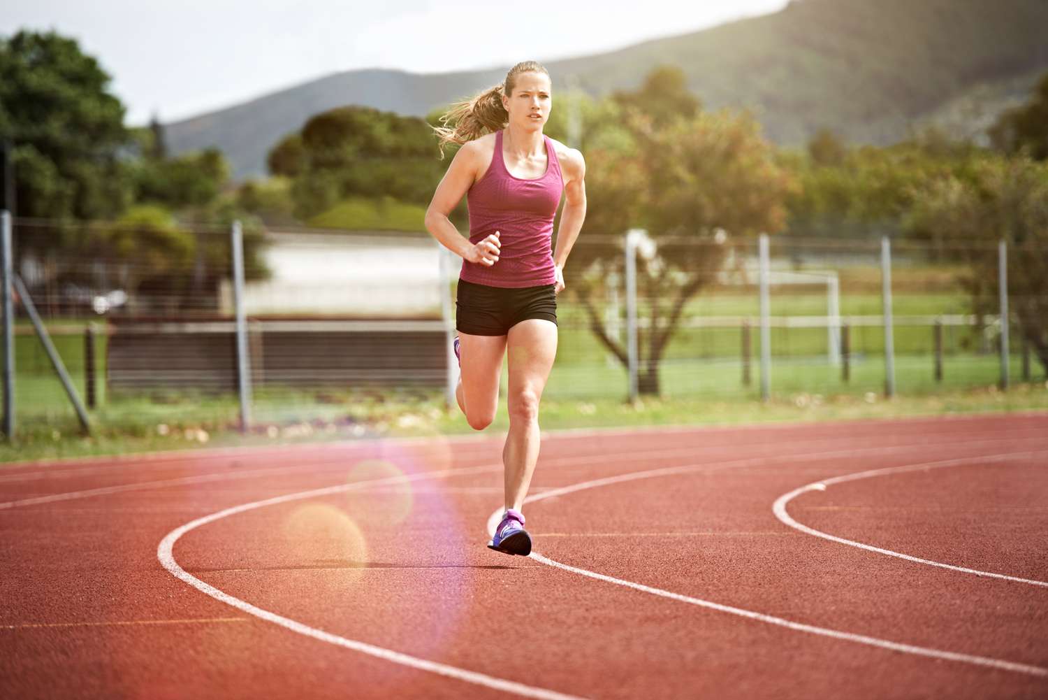 Runner is running on a track