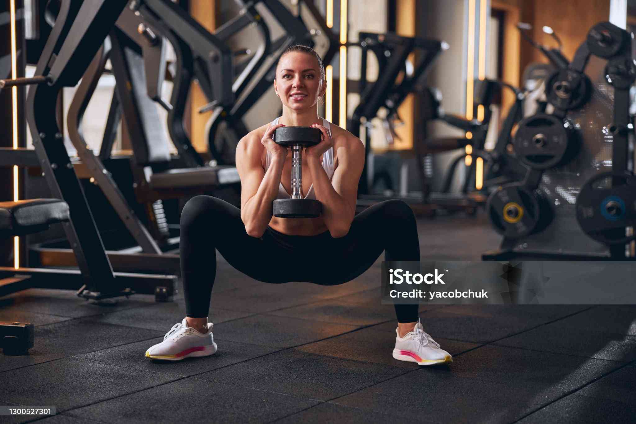 Front view of dumbbell goblet squat at home